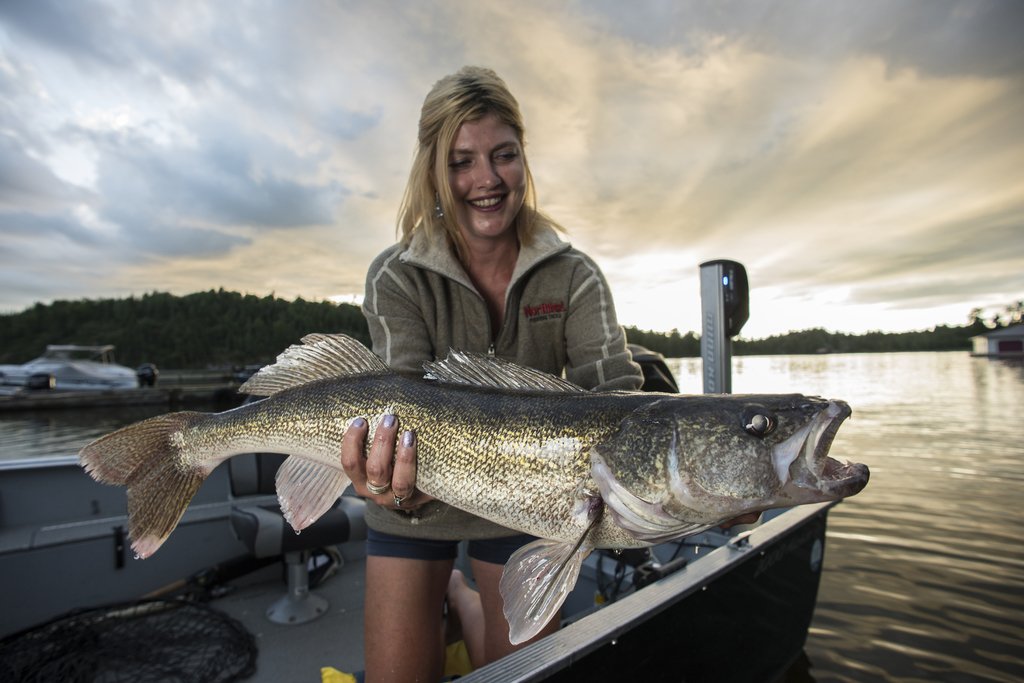 young woman, fishing, dock, lake, sunset, tackle box, relaxation